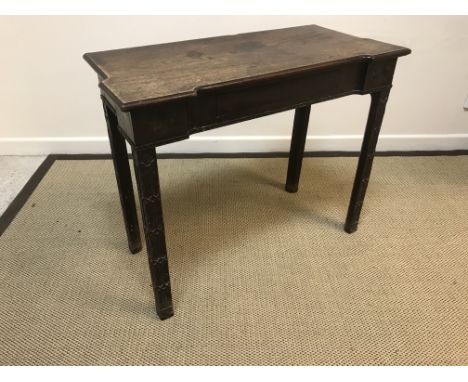 A George III mahogany side table in the Chippendale taste, the shaped top with moulded edge above a frieze drawer with egg an