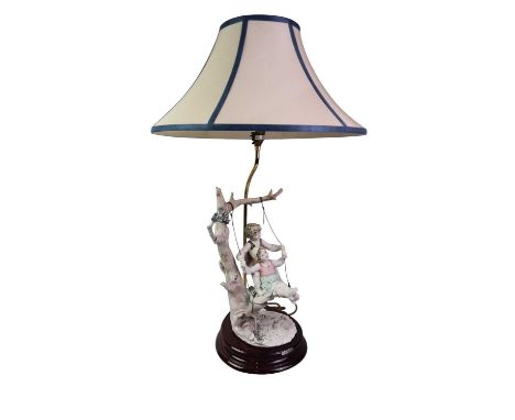 FIGURAL TABLE LAMP, B Merli, modelled with a boy and girl on a swing66cm high