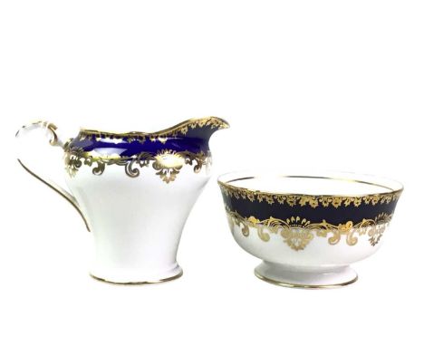 AYNSLEY TEA SERVICE, decorated with blue and gilt borders, comprising twelve cups, twelve saucers, twelve side plates, sugar 