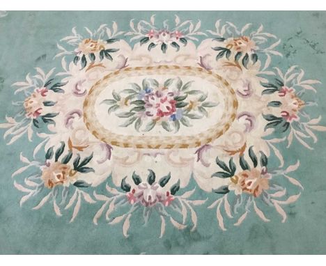 CHINESE CARPET, with floral designs on a green ground370cm x 275cm