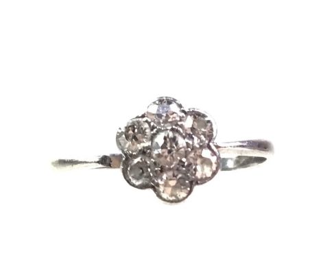 DIAMOND CLUSTER RING. set in unmarked white metal