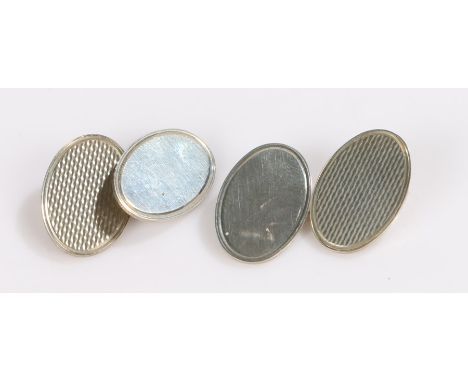 Pair of silver cufflinks, each with an oval engine turned and vacant terminal, 8.2g