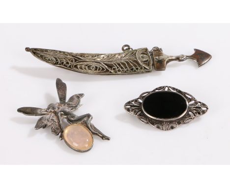 Silver brooches, to include Middle Eastern dagger and scabbard, fairy, brooch with scroll border, 14.1g (3)