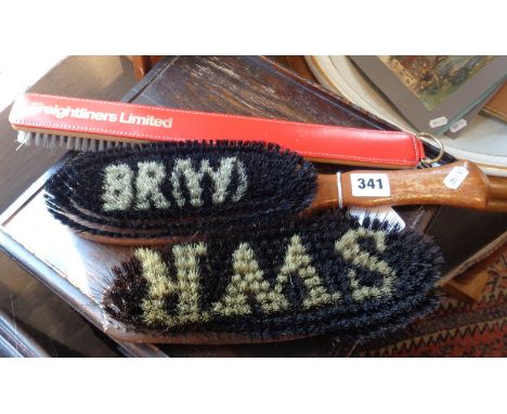 Two vintage railway brushes marked as 'BR (W)' and 'SWR' through bristles and another more contemporary 'FREIGHTLINERS LTD'