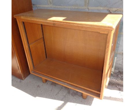 Light oak bookcase with sliding glass door