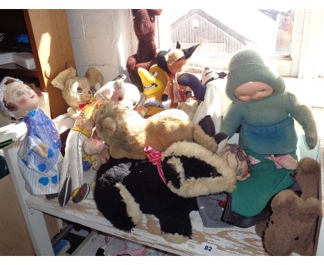 Large collection of vintage soft toys including a Merrythought Parrot on a Perch, Mickey Mouse, a badger and seven glove pupp