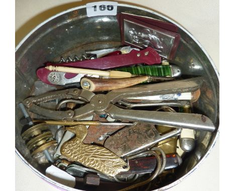 Tin of old and vintage pocket and pen knives, bottle openers, etc.