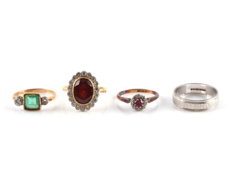 Four 18 ct gold gem set rings, including a garnet and diamond cluster ring, size P1/2, a wedding band, size R, a ruby and dia