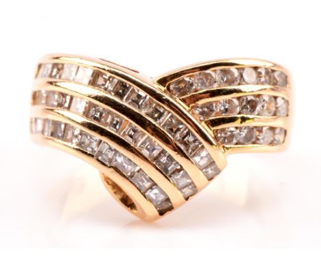 Diamond crossover ring, set with round brilliant cut diamonds on one side and square step cut diamonds on the other, channel 