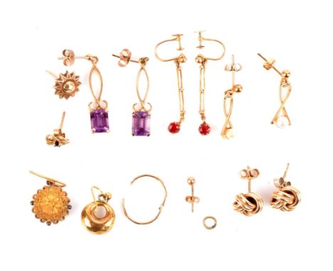 A group of gold earrings including a pair of oval opal cabochon stud earrings, lace agate drop earrings, emerald cut amethyst