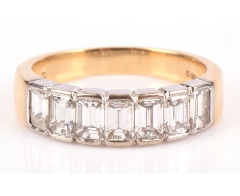 Seven stone diamond half eternity ring, emerald cut diamonds weighing an estimated total of 1.70 carats, mounted in 18 ct yel