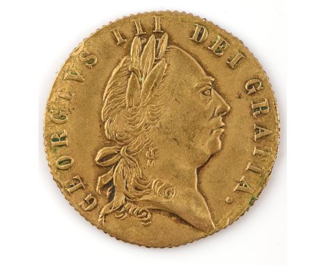 A collection of British and foreign coins and notes as taken from circulation. British materials include a ten shilling Fford