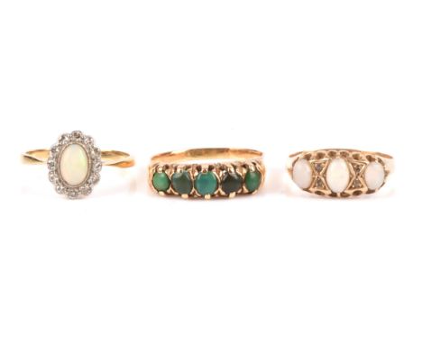 Three rings, one opal and diamond cluster ring with a 6mm x 45mm cabochon and a border of 13 old cut diamonds, ring size N, a