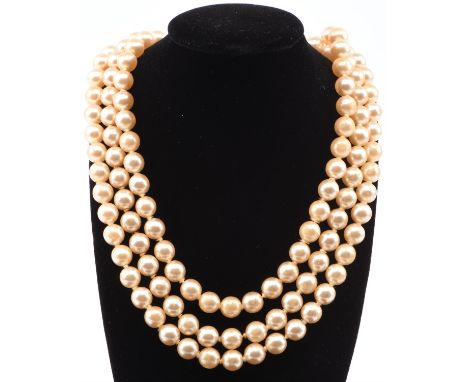 A group of costume jewellery including a synthetic ruby bracelet, a synthetic emerald bracelet and ring, a pearl necklace, an