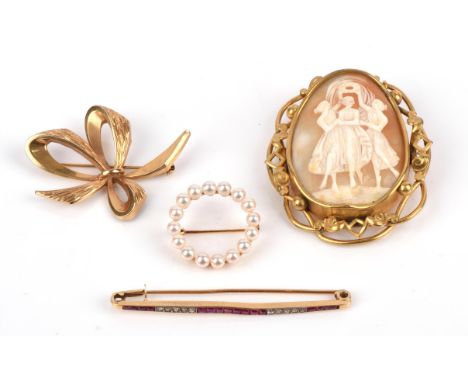 A group of brooches, including a French table cut ruby and old cut diamond bar brooch, measures 62mm x 2mm hallmarked 18 ct, 