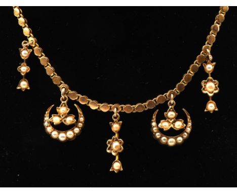 Edwardian seed pearl fringe necklace with fancy link chain tested as 15 ct, with  two crescent drops stamped 15 ct and three 