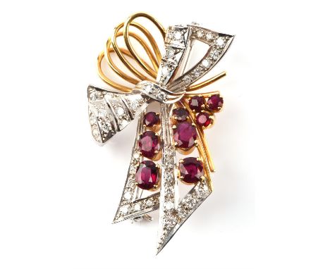 Ruby and diamond spray brooch, set with oval and round cut rubies and round brilliant cut diamonds, in 18 ct white and yellow