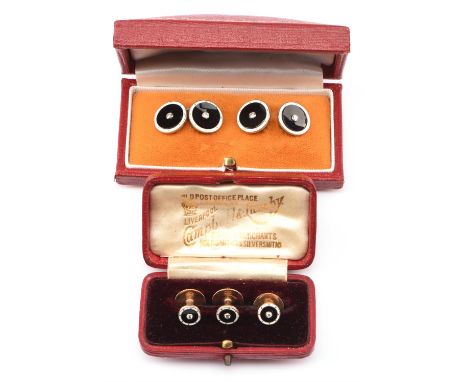 A pair of onyx, enamel and diamond cufflinks, circular design set with circular black onyx surrounded by white enamel and a c