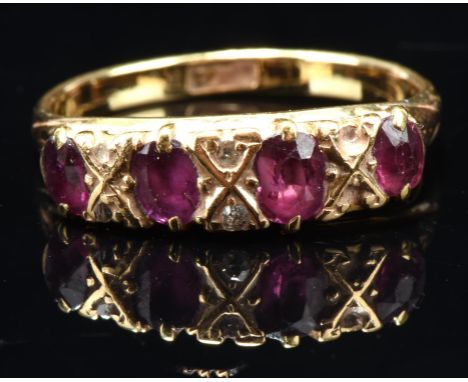 Ruby and diamond half hoop ring, set with four oval cut rubies, separated by single and rose cut diamonds, in stamped 18 ct, 