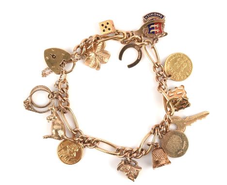 Fancy link gold charm bracelet with charms, including 18 ct swiss cottage, Philippus coin with a four leaf clover, dice, wish
