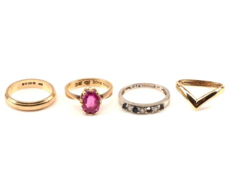 Four rings, a step cut synthetic ruby ring in 18 ct gold size J, a diamond and sapphire eternity ring in 18ct white gold size