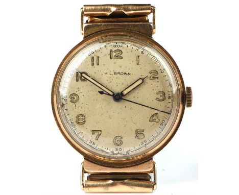  H Brown a gentleman's gold cased wristwatch the signed silvered dial with Arabic numeral hour markers within a minute track 