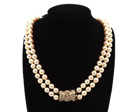 Two sets of pearls, including a two row necklace with 6mm pearls, with a round brilliant cut diamonds set clasp, in 18 ct yel