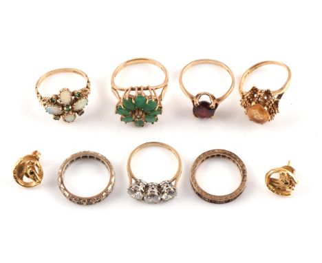 Group of 9 ct gold, including an opal and emerald ring, size Q, garnet ring, size R, a three stone cubic zirconia ring, size 