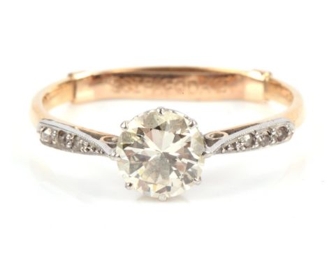 Diamond engagement ring, 0.95 carat transitional cut, with three old cut diamonds to the shoulders mounted in platinum with a