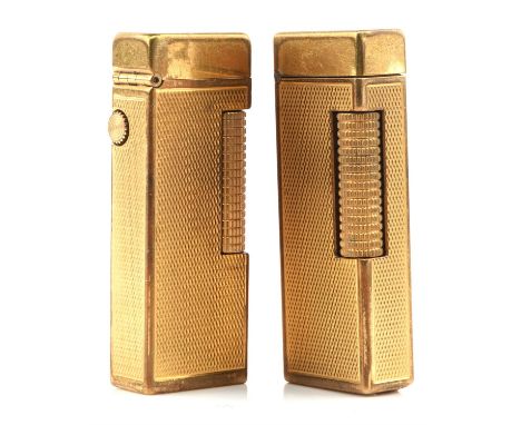 Two Dunhill Lighters, both measuring  5mm x 23mm in engine turned cases, base metal made in Switzerland Serial numbers Brit 7