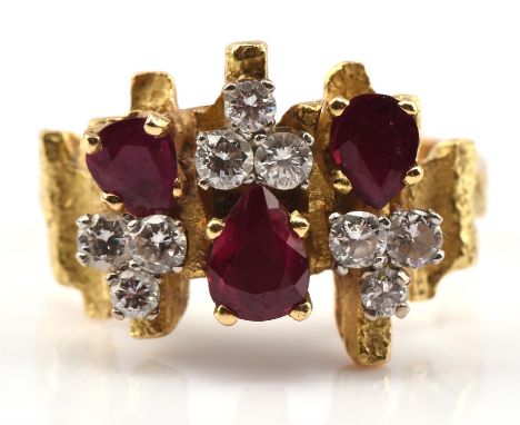 1970's ruby and diamond cluster ring, set with pear cut rubies and round brilliant cut diamonds, mounted in 18 ct yellow gold