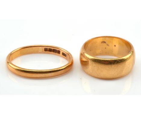 Two 22 ct gold wedding bands, one measuring 7.7mm width, ring size K, and one measuring 3mm widthCondition Report:  Gross wei