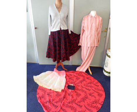 A VINTAGE 'RENJOY MODEL' 1950S FULL CIRCLE SKIRT in red flocked fabric, a similar 'Fespa Fashions' skirt, a net petticoat, a 