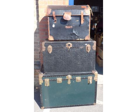 A VICTORIAN CANVAS COVERED DOMED TRUNK by Warner, Leeds, and two other large composition trunks