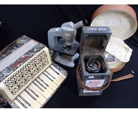 AN AMERICAN OPTICAL CORPORATION MICROSCOPE a boxed instrument, an Albani accordion (in poor condition) and a 1960s 'Handy Han