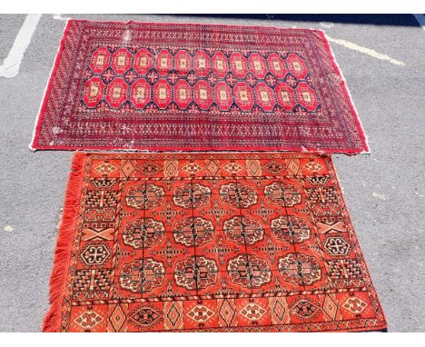 A PAKISTAN BOKHARA RUG 124 x 193cm (wear, moth damage) and an Edwardian plush 'carpet' hanging or cover (2)