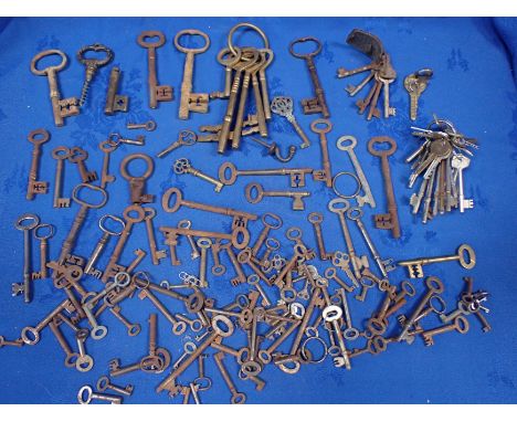 A COLLECTION OF 19TH CENTURY AND LATER KEYS including a novelty corkscrew