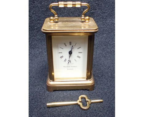 MATTHEW NORMAN, LONDON: MINIATURE CARRIAGE CLOCK timepiece, 17 jewels, 8cm high, handle up (running, but not tested at length
