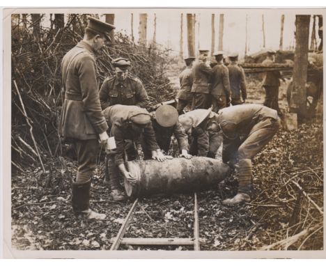British WWI RP&nbsp;Press Publication Photograph showing a 15inch Howitzer Shell being rolled to the Gun on a Light Railway t