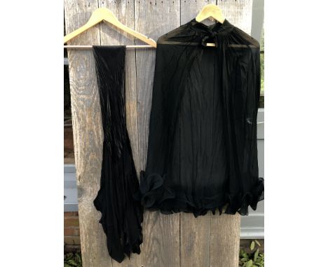 2 pieces black evening accessories. A 1930/40s silk crepe chiffon cape with neck tie and wired frill hem. A 1920/30s rayon sa