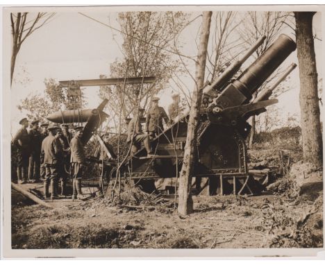 British WWI RP&nbsp;Press Publication Photograph showing a B. L. 15inch Siege Howitzer Mk. 1 being loaded ready to be fired. 