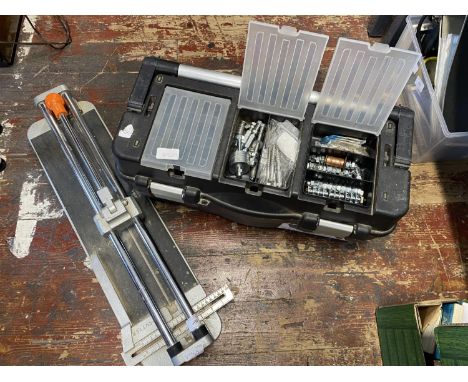A toolbox and contents and a tile cutter. Shipping unavailable 