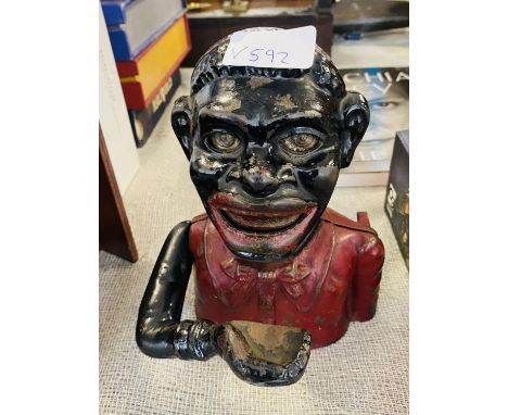 A vintage Jolly man money box Notice from the the-saleroom.com: These items are listed on the basis they are illustrative of 