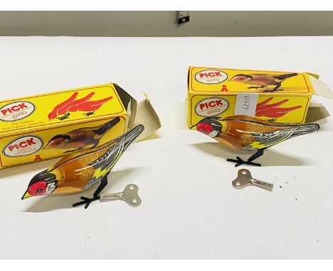 Two boxed vintage clockwork bird toys 