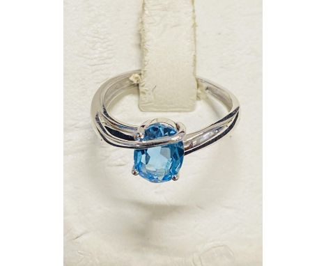 A 9ct white gold ring with large blue stone. 2.25 grams 