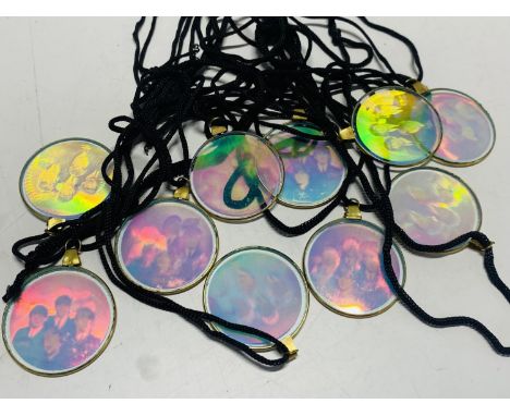 Ten vintage Beatles hologram pendants. 