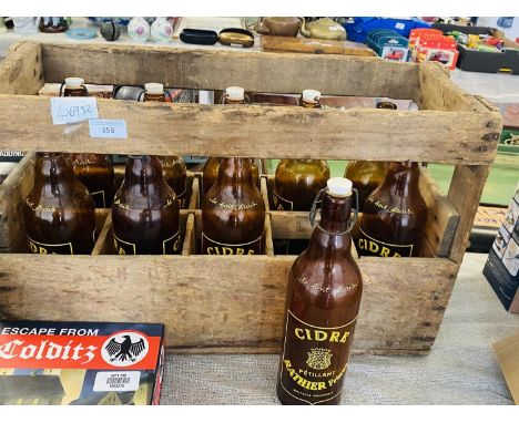 A vintage wooden cidre crate &amp; ten empty bottles 
