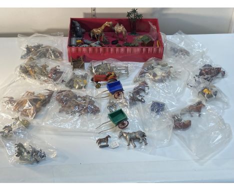 A job lot of assorted vintage farm figures including Britians and other, mainly metal 