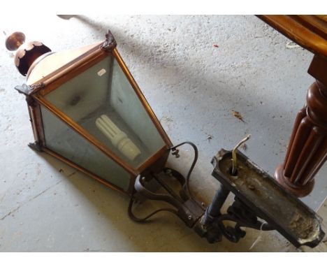 A large copper wall-mounted lantern, with wrought iron fixings, height 44" overall
