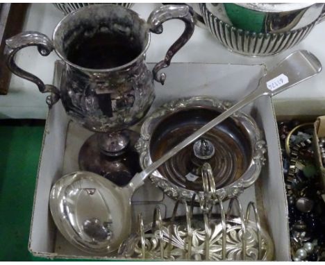 A large plated ladle, an embossed 2-handled cup, a toast rack etc